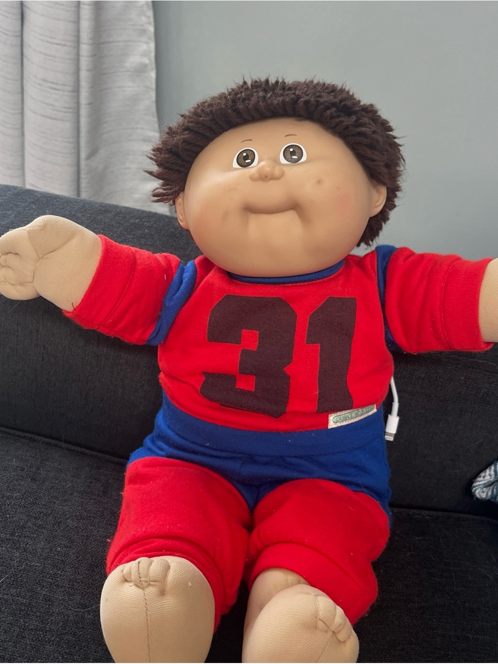 Cabbage Patch Kid with short clipped hair in sweats outfit